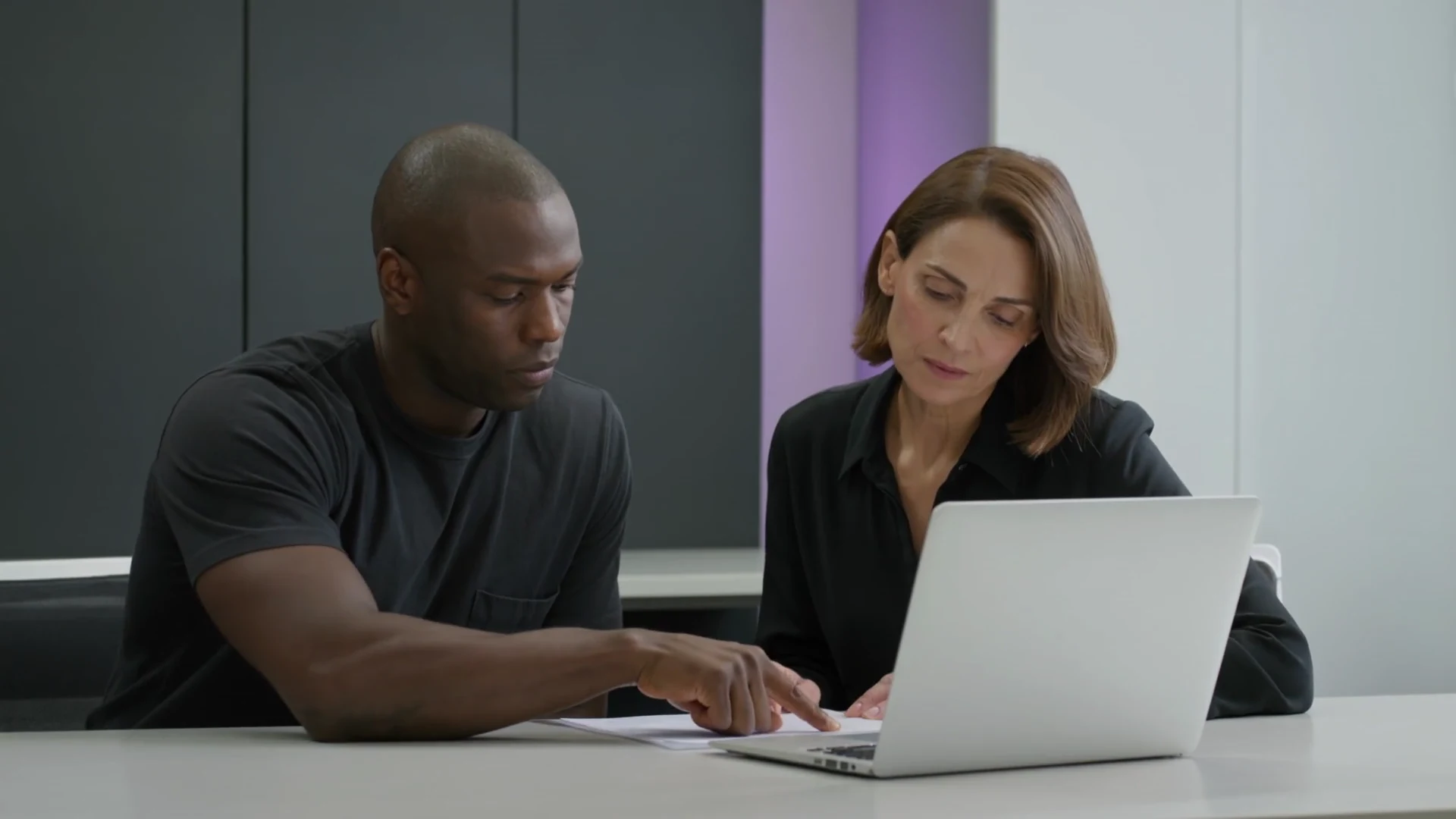 Two experts reviewing a task together